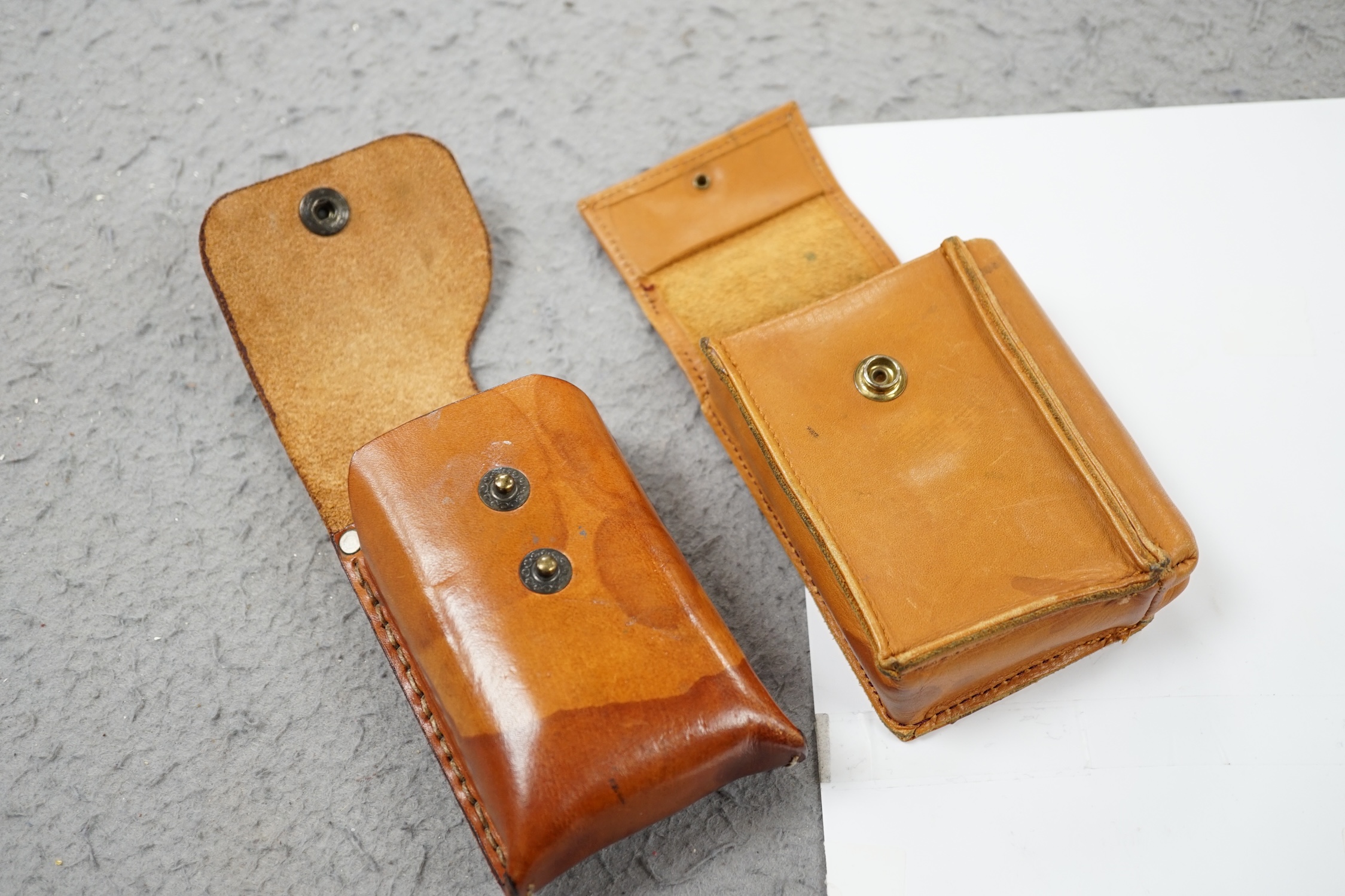 A Winsor & Newton travelling paint box and three others. Condition - fair